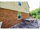 A wooden deck with a table and chairs is attached to a brick and vinyl-sided home at 5516 Northwood Dr, Hickory, NC 28601