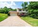 Charming two-story home featuring a spacious front yard and attached two-car garage at 5516 Northwood Dr, Hickory, NC 28601