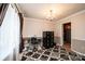 Office space with black filing cabinet, chandelier lighting, and neutral-toned walls at 5516 Northwood Dr, Hickory, NC 28601