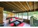 Screened patio with a wicker sectional sofa and a view of the backyard at 5516 Northwood Dr, Hickory, NC 28601