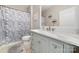 Bathroom boasts a gray vanity with white marble countertops at 7012 Somerset Springs Dr # E, Charlotte, NC 28262