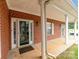 Clean brick building featuring a front door and lots of light at 7012 Somerset Springs Dr # E, Charlotte, NC 28262