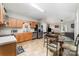 Well-lit kitchen with stainless steel appliances and adjacent dining area at 7012 Somerset Springs Dr # E, Charlotte, NC 28262