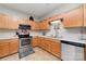Updated kitchen with stainless steel appliances and ample counter space at 7012 Somerset Springs Dr # E, Charlotte, NC 28262