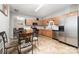 Bright kitchen featuring stainless steel appliances and adjacent dining area at 7012 Somerset Springs Dr # E, Charlotte, NC 28262