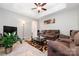 Comfortable living room with plush seating and a tray ceiling with ceiling fan at 7012 Somerset Springs Dr # E, Charlotte, NC 28262