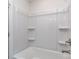 Bright bathroom features a shower-tub combo with built-in shelving at 7108 Hambright Rd, Huntersville, NC 28078