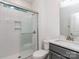 Bathroom featuring glass-enclosed shower with tiled walls, and a modern vanity at 7108 Hambright Rd, Huntersville, NC 28078