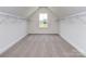 Spacious walk-in closet with ample shelving on white walls and neutral carpeting at 7108 Hambright Rd, Huntersville, NC 28078