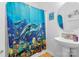 Cheerful bathroom with vibrant ocean-themed shower curtain and pedestal sink at 7138 Somerset Springs Dr, Charlotte, NC 28262