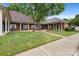 Charming brick exterior with well-manicured lawn and inviting walkways at 7138 Somerset Springs Dr, Charlotte, NC 28262
