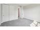 Bedroom with neutral carpeting, double door closet and white trim at 720 Flare Dr, Tega Cay, SC 29708