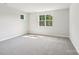 Bright bedroom with neutral carpeting and a large window offering natural light at 720 Flare Dr, Tega Cay, SC 29708