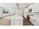 Bright, eat-in kitchen features stainless appliances, granite countertops and stylish backsplash, flowing into the living room at 720 Flare Dr, Tega Cay, SC 29708