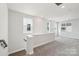 Bright loft area with neutral carpeting, ample windows, and a half wall at 720 Flare Dr, Tega Cay, SC 29708