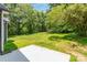 Expansive backyard featuring lush greenery and ample space for outdoor activities at 925 4Th St, Statesville, NC 28677