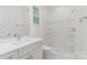 Clean white bathroom with vanity, shower and tiled floor at 925 4Th St, Statesville, NC 28677
