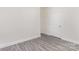 Clean and neutral bedroom with gray vinyl flooring and white doors and trim at 925 4Th St, Statesville, NC 28677