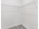 Walk-in closet with wire shelving for storage and gray vinyl flooring at 925 4Th St, Statesville, NC 28677