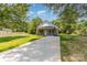 View of the house with a long driveway and green lawn at 925 4Th St, Statesville, NC 28677