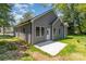 Gray vinyl siding and a concrete patio, with a yard at 925 4Th St, Statesville, NC 28677