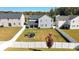 Large fenced backyard featuring a playset and trampoline, offering ample space for outdoor activities at 9419 Silverdale Ln, Charlotte, NC 28269