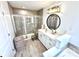 Modern bathroom featuring a glass-enclosed shower, vanity, and stylish fixtures at 9419 Silverdale Ln, Charlotte, NC 28269