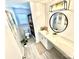 Stylish bathroom with a modern vanity, round mirror, and contemporary lighting fixture at 9419 Silverdale Ln, Charlotte, NC 28269