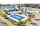 Aerial view of a large community pool area with playground and nearby parking at 9419 Silverdale Ln, Charlotte, NC 28269