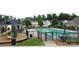 Resort-style community pool with plenty of lounge chairs, playground, and tables for relaxing by the pool at 9419 Silverdale Ln, Charlotte, NC 28269