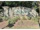 Stone monument sign for Meridale community with lush landscaping around the base of the sign at 9419 Silverdale Ln, Charlotte, NC 28269