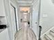 Hallway featuring light gray floors and white doors at 9419 Silverdale Ln, Charlotte, NC 28269
