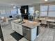 Stylish, open concept kitchen with an island, granite counters and view to living room at 9419 Silverdale Ln, Charlotte, NC 28269