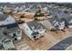 Stunning aerial view of a two-story home nestled in a vibrant community with manicured lawns and inviting curb appeal at 966 Nw Parkland Pl, Concord, NC 28027