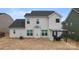 Backyard view of the home's exterior featuring a patio and pergola at 966 Nw Parkland Pl, Concord, NC 28027