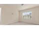 Cozy bedroom with a window, neutral walls, and carpet flooring at 966 Nw Parkland Pl, Concord, NC 28027