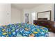 Spacious bedroom featuring a walk-in closet, a view of the bedroom suite, and a large dresser at 966 Nw Parkland Pl, Concord, NC 28027