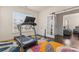 Bright exercise room with a treadmill and French doors leading to another room at 966 Nw Parkland Pl, Concord, NC 28027