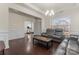 Inviting living room featuring hardwood floors, crown molding, and comfortable seating at 966 Nw Parkland Pl, Concord, NC 28027
