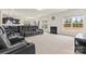 Open-concept living area with plush seating, a fireplace, and an abundance of natural light at 966 Nw Parkland Pl, Concord, NC 28027