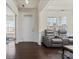 Bright living room with a view of the front door and comfortable leather seating at 966 Nw Parkland Pl, Concord, NC 28027