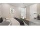 Bright bedroom with a neutral color palette, showcasing an open doorway and modern accents at 9864 Quercus Ln, Huntersville, NC 28078