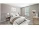 Peaceful bedroom with soft hues, natural light, and comfortable furnishings for a restful retreat at 9864 Quercus Ln, Huntersville, NC 28078