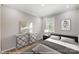 Cozy bedroom featuring neutral tones, natural light, and stylish decor, perfect for relaxation at 9864 Quercus Ln, Huntersville, NC 28078