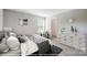 Calm bedroom featuring neutral colors, a cozy bed, and minimalist decor for relaxation at 9864 Quercus Ln, Huntersville, NC 28078