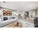 Spacious living room with contemporary decor, plush seating, and ample natural light at 9864 Quercus Ln, Huntersville, NC 28078