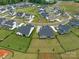 Aerial view of homes in a neighborhood with a mix of colors and varying lot sizes at 1005 Willow Bank Ln, Belmont, NC 28012