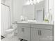 Displays a double vanity, neutral color scheme, and contemporary fixtures at 1005 Willow Bank Ln, Belmont, NC 28012