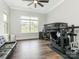 Features a gaming setup, couch, and abundant natural light at 1005 Willow Bank Ln, Belmont, NC 28012