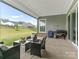 Covered patio with outdoor seating and a grill, perfect for outdoor entertaining at 1005 Willow Bank Ln, Belmont, NC 28012